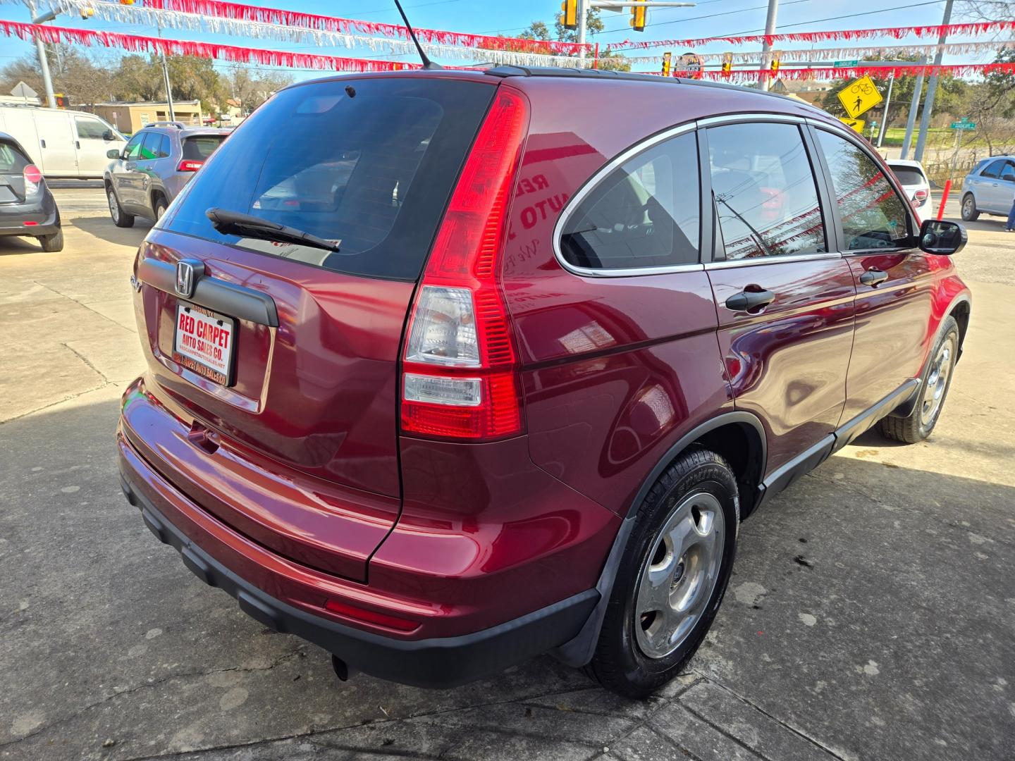 2011 Red Honda CR-V (5J6RE3H34BL) with an 2.4L I4 F DOHC 16V engine, Automatic transmission, located at 503 West Court, Seguin, TX, 78155, (830) 379-3373, 29.568621, -97.969803 - Photo#2